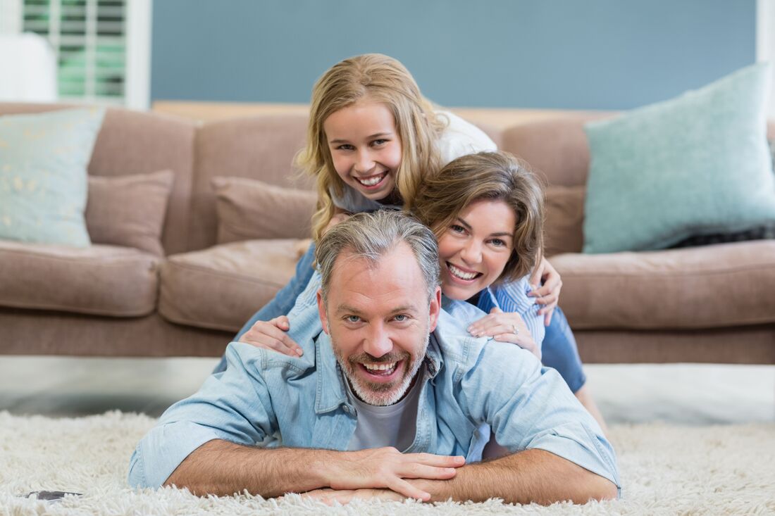 happy family on professionally cleaned carpets